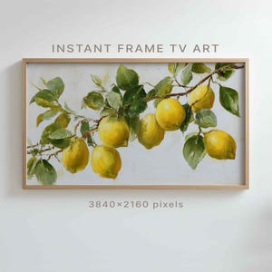 May include: A framed artwork featuring a branch of lemons with green leaves. The painting has a light background and the text "INSTANT FRAME TV ART" is at the top. The frame is a light brown color. The image resolution is 3840x2160 pixels.