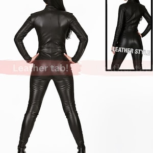 May include: Black leather jumpsuit with a high collar and long sleeves. The outfit includes matching pants and platform boots. The image also includes a smaller framed image with the text "LEATHER STYLE". The text "Leather tab!" is also visible.