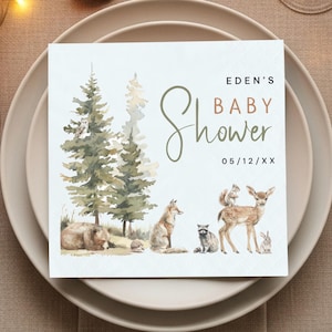 May include: A square baby shower invitation with a forest theme. The invitation features watercolor illustrations of trees, a bear, fox, raccoon, deer, squirrel, and rabbit. The text reads "Eden's Baby Shower" and the date.