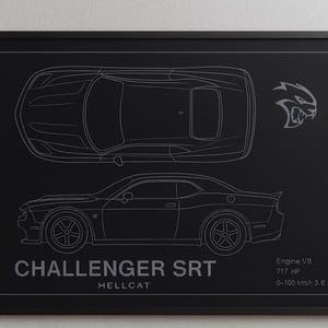 May include: Framed black print featuring a detailed outline of a Challenger SRT Hellcat car, with top and side views. Includes the car's logo and specifications: Engine V8, 717 HP, and 0-100 km/h in 3.6 seconds. A sleek, modern design.