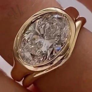 East To West 3 CT Oval Cut Moissanite Bezel Set Solitaire Ring, Paired With Matching Curved Shape Plain Band, 925 Silver Bridal Ring Set