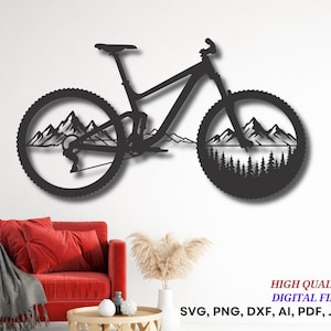 May include: A black metal wall art piece shaped like a mountain bike. The wheels contain intricate cutouts of mountain peaks and a dense pine forest. The text "HIGH QUALITY DIGITAL FILES SVG, PNG, DXF, AI, PDF, JPG" is printed in the corner.