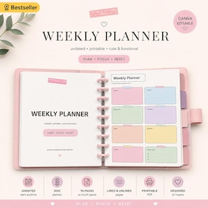 Puede incluir: Una agenda semanal rosa de encuadernación de discos con páginas sin fecha. La página izquierda muestra el texto WEEKLY PLANNER, PLAN, FOCUS, RESET. La página derecha presenta cajas rectangulares de colores para cada día y metas semanales.