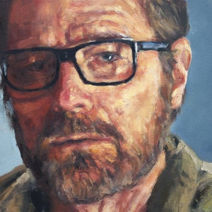 May include: A close-up portrait painting of a man with a beard and glasses. The man is wearing a brown jacket and has a serious expression on his face.