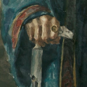 May include: A close-up of a hand holding a silver-colored walking stick with a dark brown handle. The hand is wearing a blue and red sleeve.