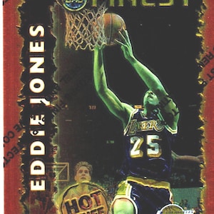 May include: A basketball trading card featuring Eddie Jones of the Los Angeles Lakers. The card has a red and gold border with the words "Topps Finest" at the top. Jones is shown in action, reaching for the basket. The card also has a "Hot Stuff" logo.