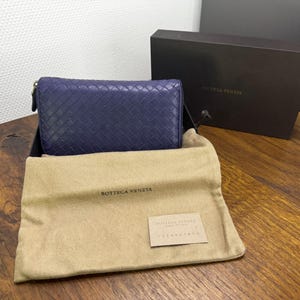 Bottega Veneta Reißverschluss Lange Brieftasche aus Leder Intrecciato Lila