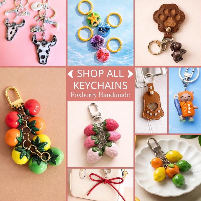 Puede incluir: Una colecci&oacute;n de llaveros hechos a mano con varios dise&ntilde;os. Los llaveros incluyen un toro, criaturas marinas, una huella de pata con un perro, un racimo de tomates, fresas, un oso con un paraguas y un racimo de limones y naranjas. Tambi&eacute;n se ve el texto "SHOP ALL KEYCHAINS Foxberry Handmade".