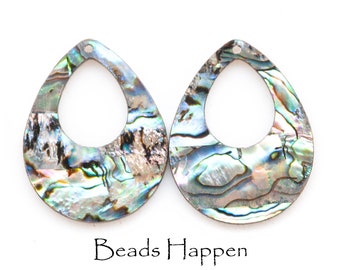 May include: Two iridescent abalone shell teardrop shaped pendants with a hole at the top for stringing. The pendants have a natural, organic pattern and a blue, green, and silver color scheme.