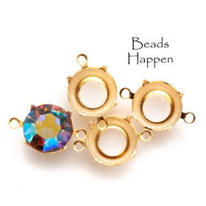 May include: Three gold-tone metal bead settings with a single iridescent gemstone bead. The settings have three loops for attaching to jewellery.