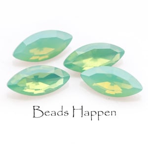 May include: Four marquise-shaped green opal beads with a slight yellow hue. The beads are faceted and have a smooth, polished finish.