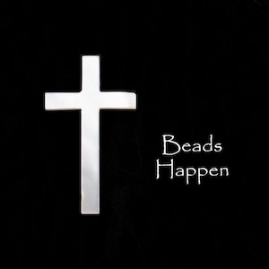 Puede incluir: Una cruz blanca sobre un fondo negro con el texto "Beads Happen" escrito debajo.