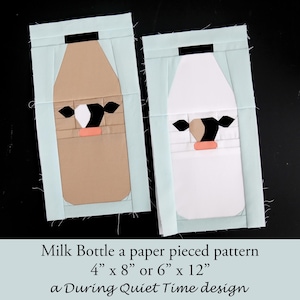 Puede incluir: Dos bloques de acolchado de botella de leche hechos con piezas de papel, uno marrón y otro blanco, con un diseño de cara de vaca en blanco y negro. Los bloques miden 4 pulgadas por 8 pulgadas o 6 pulgadas por 12 pulgadas. Milk Bottle a paper pieced pattern 4" x 8" or 6" x 12" a During Quiet Time design