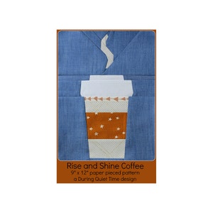 May include: A paper pieced pattern for a coffee cup with a steam rising from the top. The pattern is 9 inches by 12 inches and is called "Rise and Shine Coffee". It is a During Quiet Time design.