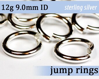 May include: A close-up of silver jump rings, 12 grams each, with an inner diameter of 9.0 mm. The rings are made of sterling silver and are scattered on a white surface.