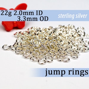 May include: A pile of silver jump rings, 22 gauge, 2.0 mm inner diameter and 3.3 mm outer diameter, sterling silver.