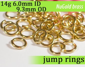 May include: A pile of 14 gauge brass jump rings, 6.0mm inner diameter and 9.3mm outer diameter. NuGold brass jump rings.