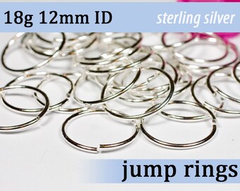 May include: A collection of shiny, silver jump rings. The text on the image reads "18g 12mm ID" and "sterling silver". The jump rings are open and ready for use in jewelry making or other crafts.