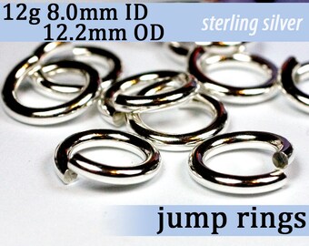 May include: A close-up of silver jump rings, 12g in weight, with an inner diameter of 8.0mm and an outer diameter of 12.2mm. The rings are made of sterling silver.