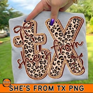 May include: A light gray t-shirt featuring the text "She's From TX" in a brown and leopard print design. The letters are outlined with gold glitter and adorned with brown bows. The bottom of the shirt has the text "SHE'S FROM TX PNG".