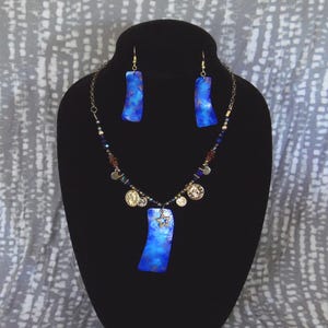 Blue Delight, blue and gold, gourd shard necklace, beads and charms, 19 1/2” length, with earrings