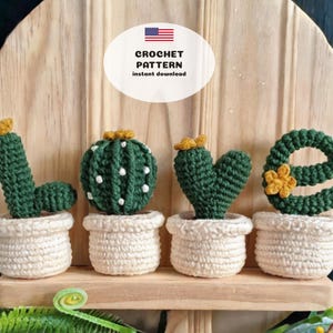 May include: A decorative display featuring the word "LOVE" spelled out with crocheted cactus plants. Each letter is a different cactus shape, in green with yellow accents, potted in off-white containers. The image includes text that says "CROCHET PATTERN instant download".