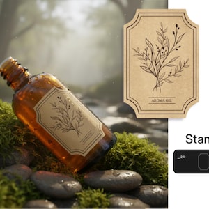Peut inclure: Flacon d'huile aromatique en verre ambr&eacute; avec une &eacute;tiquette botanique. L'&eacute;tiquette pr&eacute;sente un dessin au trait de feuilles et les mots "AROMA OIL". Le flacon repose sur des rochers couverts de mousse.