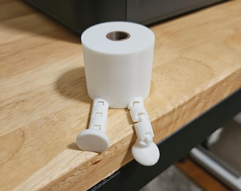 3D printed mini toilet paper with legs. Fun gag gift.