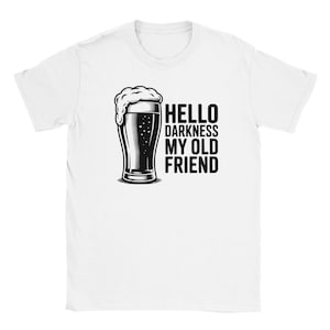 May include: White t-shirt featuring a black and white illustration of a beer glass with foam, and the text "HELLO DARKNESS MY OLD FRIEND". The design is centered on the shirt.