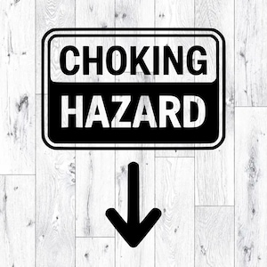 May include: A black and white sign with the words "CHOKING HAZARD" in bold, capital letters. Below the text is a black arrow pointing downwards. The sign is rectangular with rounded corners.