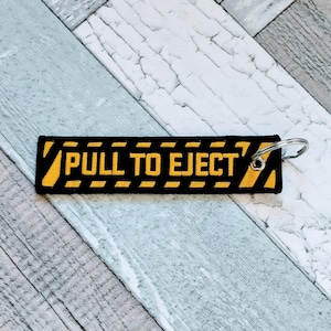 Funny Pull To Eject Luggage Tag Keyring: Airplane Travel Gifts