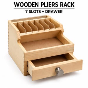 May include: A light-colored wooden pliers rack featuring seven vertical slots for tool storage and one lower pull-out drawer with a metallic hexagonal knob. The text WOODEN PLIERS RACK 7 SLOTS + DRAWER is displayed above the organizer.