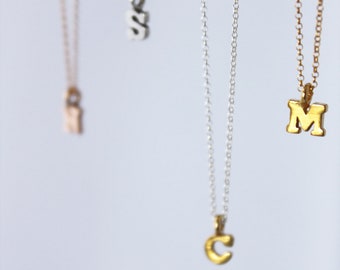 tiny gold letters or numbers. sterling silver or 14k yellow gold vermeil. delicate chain. personalized • • initial necklace