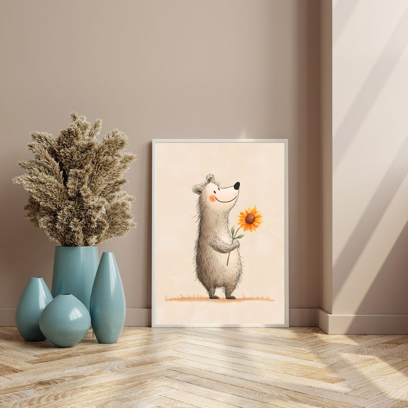May include: A framed art print featuring a cartoon bear holding a sunflower. The bear is light gray with a smiling face. The sunflower is yellow with a brown center. The background is a light beige color.