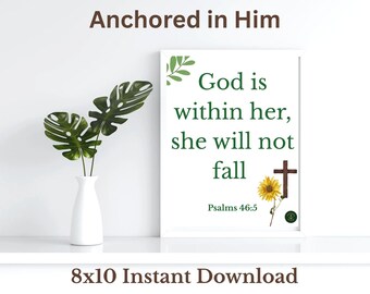 May include: A framed print with the text "God is within her, she will not fall" and "Psalms 46:5". The print is decorated with a sunflower and a cross. A white vase with green leaves is on the left. The text "Anchored in Him" is at the top.