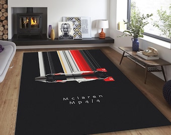 May include: Black and red rug with a white racing stripe design. The rug features a silhouette of a McLaren MP4/14 race car.