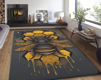 May include: A gray area rug with a yellow and black bee illustration. The bee is sitting on a honeycomb with dripping honey.