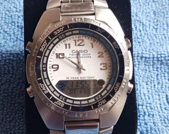 Reloj Casio para hombre, modelo AMW-700D7-AV, de acero inoxidable, ideal para la pesca.