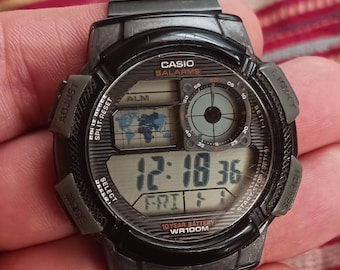 Casio World Timer Watch: Black Resin, Stainless Steel Band, Digital Display