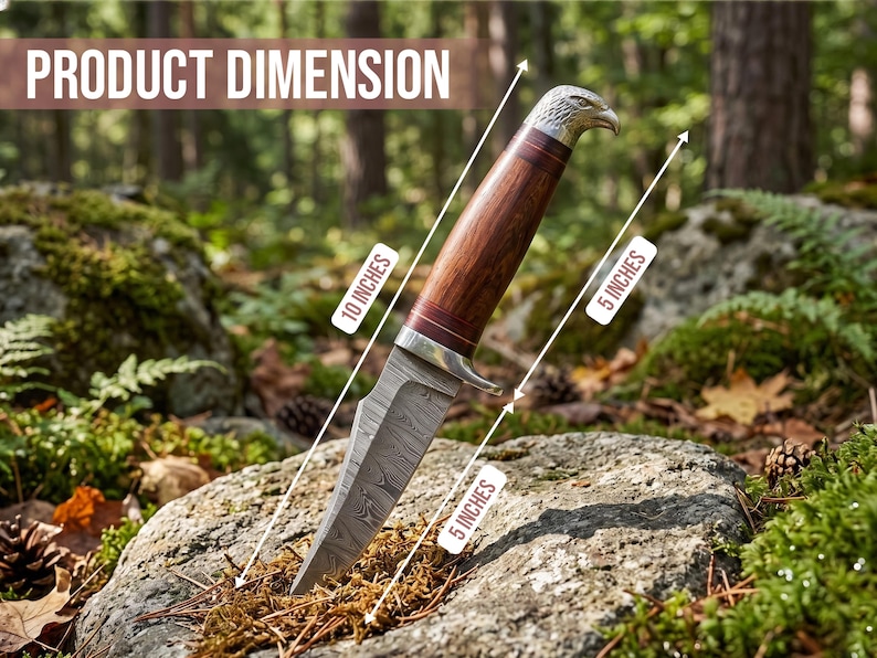 May include: A decorative knife with a 10-inch handle and a 5-inch blade. The handle is brown with a silver eagle head design. The blade has a patterned design. The knife is displayed on a rock in a forest setting.