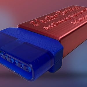 May include: A red and blue rectangular device with the text "Vector Workshop Software Solutions" embossed on the red top. The blue section has multiple holes. The device is angled against a gradient background.