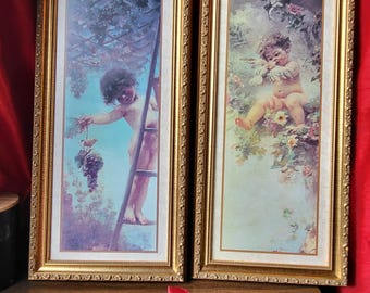 Vintage carved wooden frame with cute cherubs.