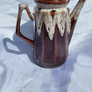 Vintage white and brown ceramic enamel coffee maker in good condition.