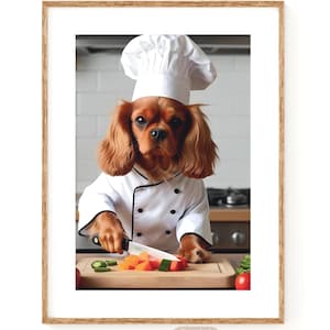 Puede incluir: Impresión enmarcada de un Cavalier King Charles Spaniel vestido de chef, con gorro y chaqueta blancos. El perro corta verduras en una tabla de madera. La impresión incluye el texto "POP" y "Digital Download".