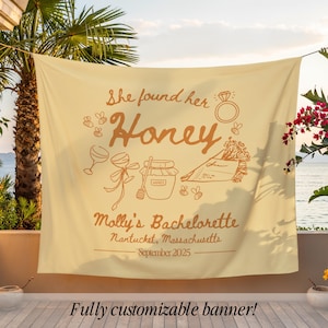 May include: A beige banner with the text "She found her Honey" and "Molly's Bachelorette" in brown. The banner includes illustrations of a ring, wine glasses, honey jar, and flowers. The banner is fully customizable.