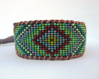 Geometric Mandala Men's Boho Cuff Bracelet on Chocolate Deer Hide Leather, Green and Purple Seed Beads