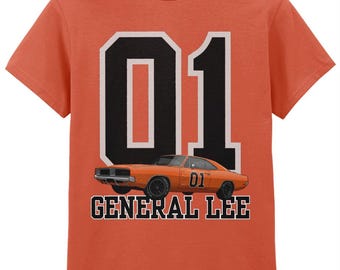 May include: Orange t-shirt featuring a graphic of an orange car with the number "01" and the words "General Lee" in black and white. The shirt is a solid orange color.
