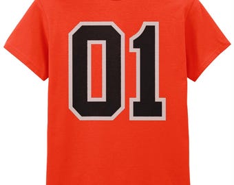 May include: A bright orange short-sleeve t-shirt featuring a large, bold graphic of the number 01 printed in black with a light gray outline centered on the chest. The shirt has a classic crew neckline and a standard fit design.