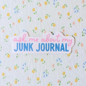 May include: A rustic wooden sign with the text "Welcome to our home" in white lettering. The sign has a distressed finish and a simple, inviting design, ideal for front door decor.