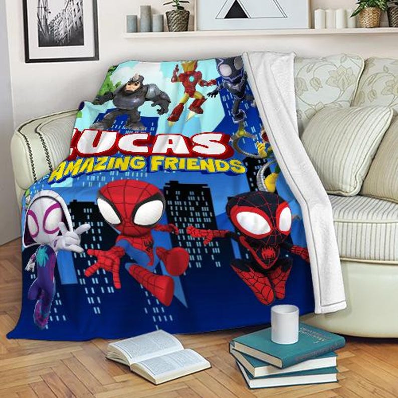 May include: A blue blanket featuring cartoon superheroes, including Spider-Man and Iron Man, with the text "LUCAS AMAZING FRIENDS." The blanket has a cityscape background and is draped over a sofa.